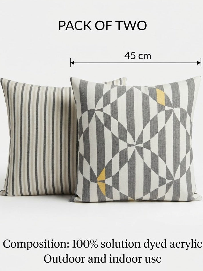 Two decorative throw pillows shown on a light gray background with overlaid dimension lines and text reading 'PACK OF TWO', '45 cm', '45 cm', and promotional text about composition and outdoor/indoor use.